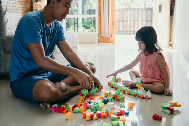 istock father and daughter playing puzzle 1149198075