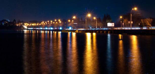 Night city light reflection on the lake