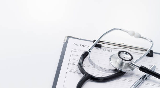 istock Stethoscope and medical record on white background. 1149201010