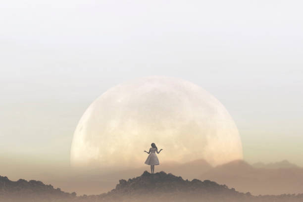 woman meditates in front of a giant moon