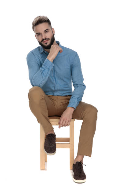 istock business student sitting relaxed and thinking with hand at chin 1149202308