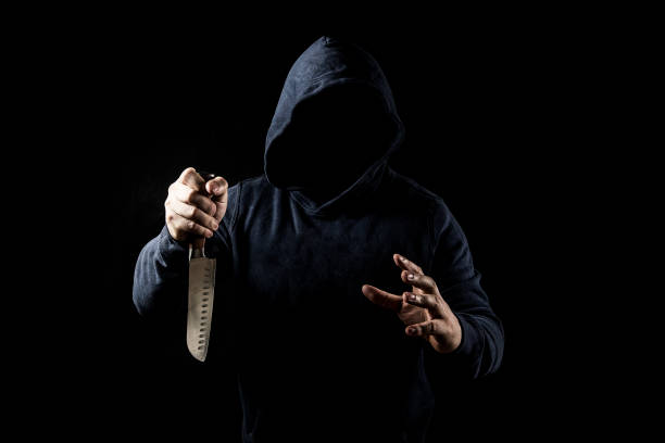 istock Bandit with knife on dark background 1149203166