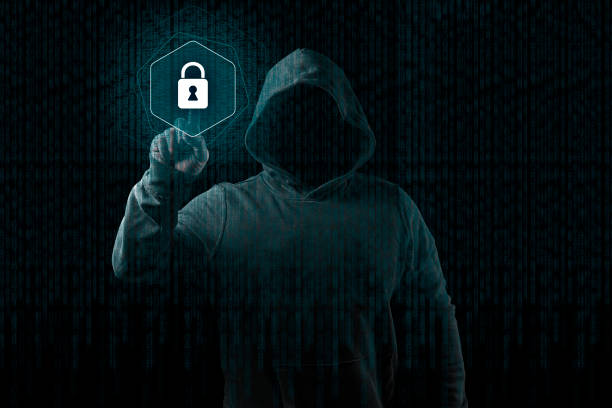 istock Anonymous computer hacker over abstract digital background. Obscured dark face in mask and hood. Data thief, internet attack, 1149203224