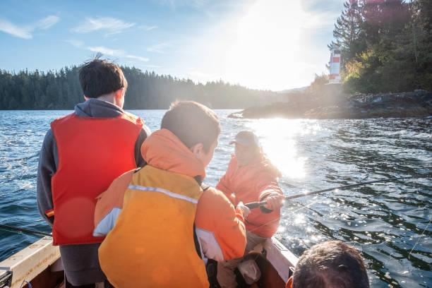 istock Multi-Ethnic Brothers in Boat Learning to Fish with Uncle, Father 1149203477