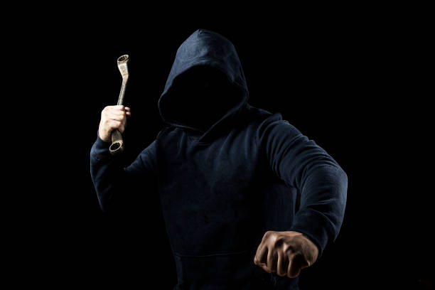 istock a man holding a tool ready to fightIron rodHammer 1149203555