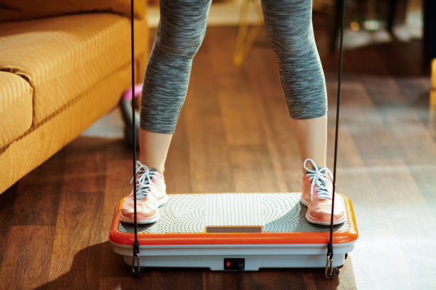 istock Closeup on sports woman training using vibration power plate 1149203564