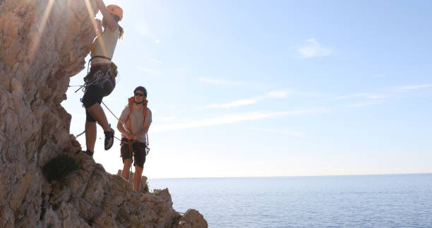 istock Mountaineers climb above the Mediterranean sea 1149204809