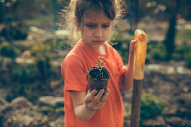 Kid helping in a garden