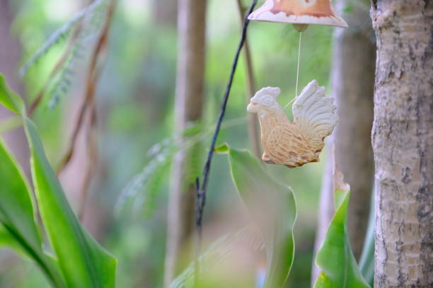 istock Ceramic doll hanging decoration in the garden 1149205857