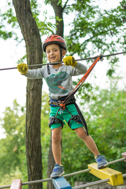 istock Boy at climbing activity in high wire forest park. Table Mountain Cableway kids special on again. 1149206451