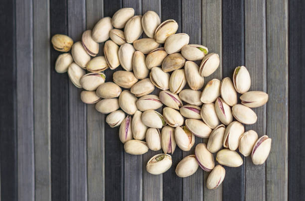 istock Healthy food  for background image close up pistachios nuts. Texture Nuts on top view mock up pistachio 1149207267