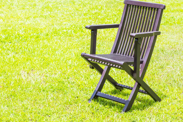 istock Black wooden chairs on the lawn. 1149207681