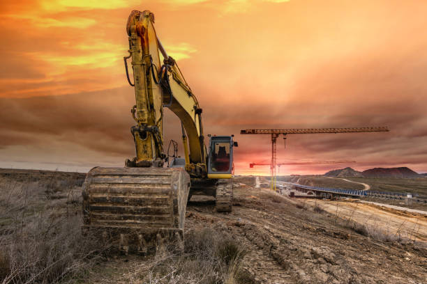 istock Excavator on the construction works of a highway and a bridge 1149207853