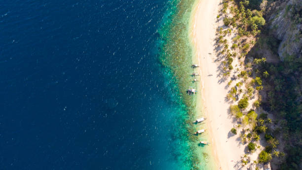 istock Tropical white sand beach. Island with a blue lagoon 1149213190