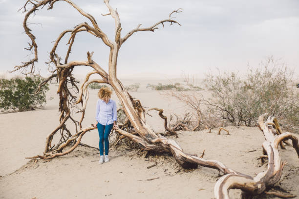 istock Woman Standing In Desert Against Sky 1149213709