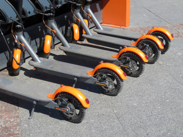 Electric scooters in a row on a parking lot