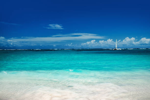 istock Beautiful caribbean sea and boat , panoramic view from the beach 1149214955