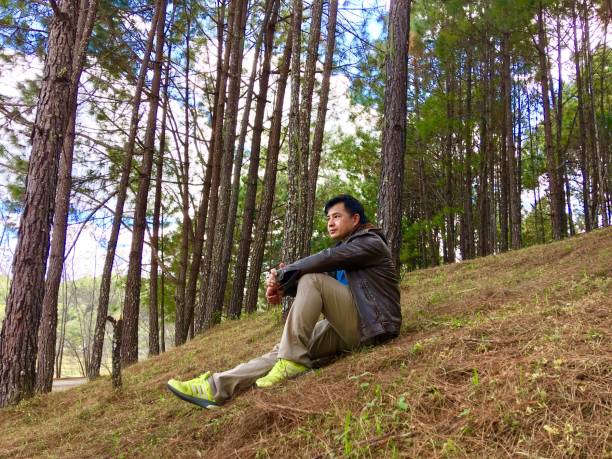istock Full Length Of Man Relaxing At Forest 1149215042