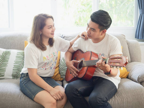 istock Couples are enjoying the guitar together happily 1149216461