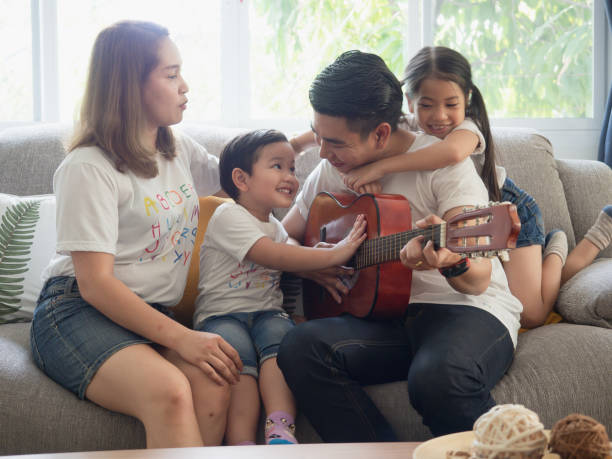 istock Father playing guitar for family 1149217092