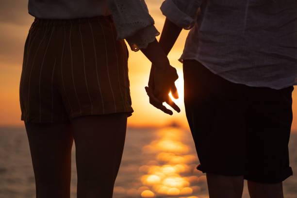 istock Romantic couple enjoying sunset 1149221518