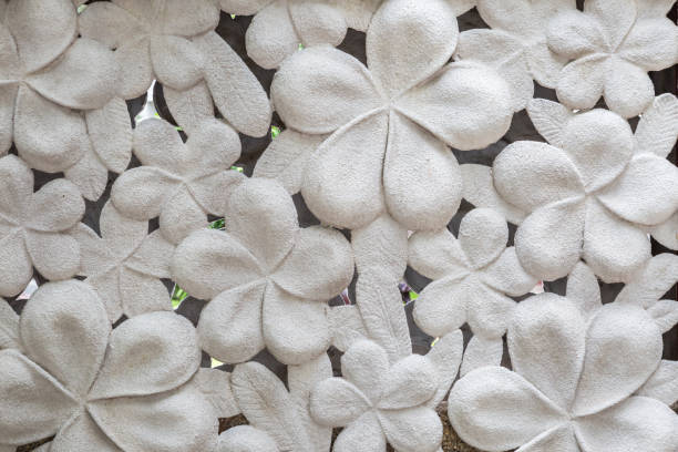 istock White cement  hibiscus flower stone 1149221546