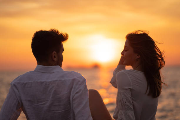 istock Romantic couple enjoying sunset 1149221558