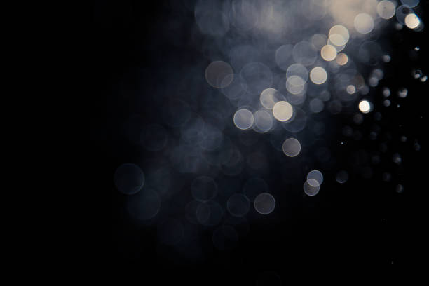 istock bokeh of water fly and lights on black background, 1149221603
