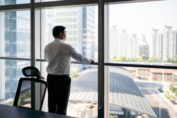 istock Mature businessman standing by the window 1149221922