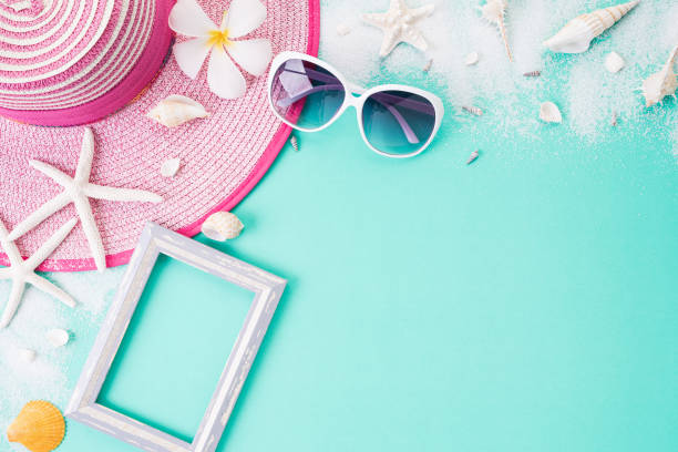istock Beach accessories Picture Frame, sunglasses, starfish beach hat and sea shell on bright pastel green background for summer holiday and vacation concept. 1149224000