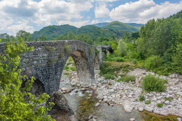 historic stone bridge at the Ardeche river in southern France