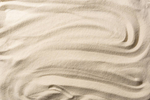 istock top view of textured sandy beige background with smooth waves 1149225487