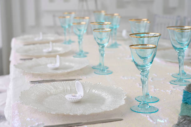 istock Seashell plate with pearl  and blue glasses 1149225859