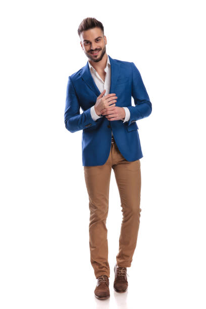 istock young guy in suit standing with hands together 1149227441