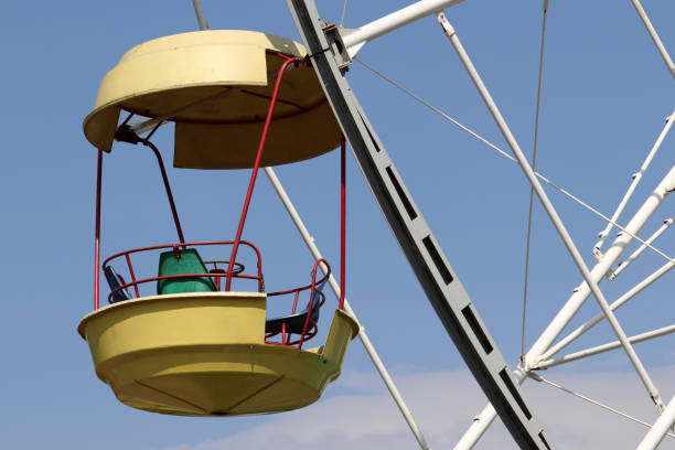 istock Ferris wheel cabin on blue sky background 1149227577