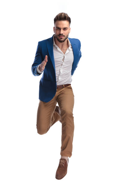 istock fashion man in suit sprinting fast 1149228394