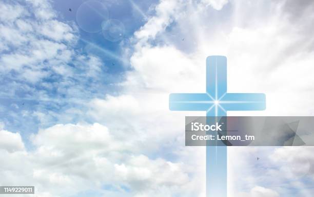 Crucifix Cross On Beautiful Sky With Sunbeam Holy Cross Of Jesus Christ On Clouds Background Stock Photo - Download Image Now