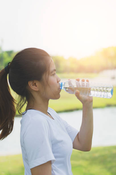 istock Sporty woman drinking water 1149230597