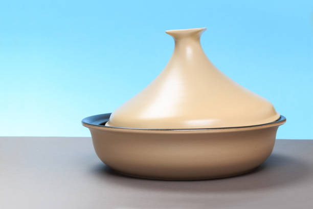 istock A new ceramic pan stands on a gray table and a blue background. 1149232592