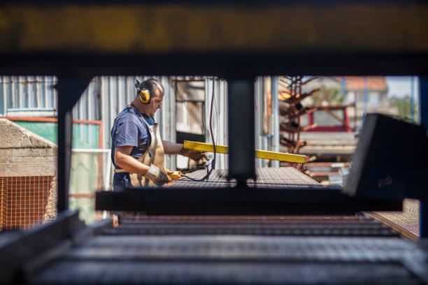 istock Metal worker working on industrial machine in a factory. 1149233403