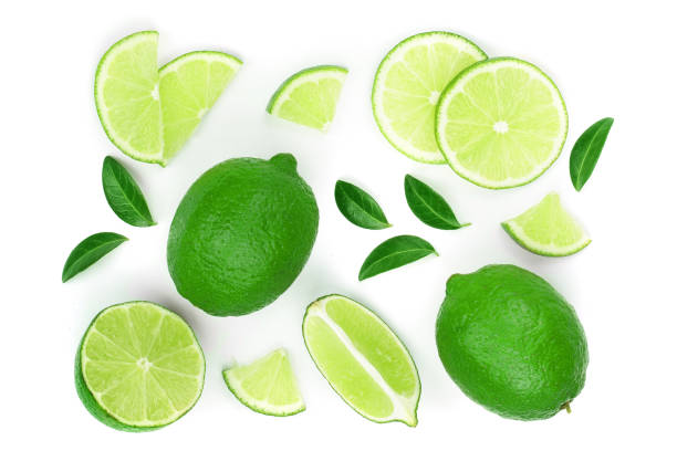 istock sliced lime with leaves isolated on white background. Top view. Flat lay pattern 1149233893