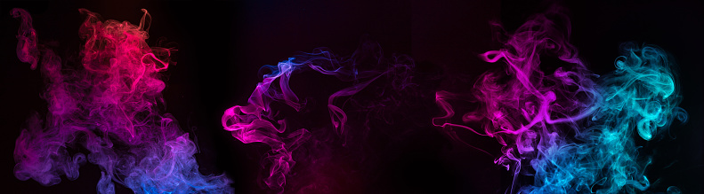 blue and purple swirls of smoke on black background