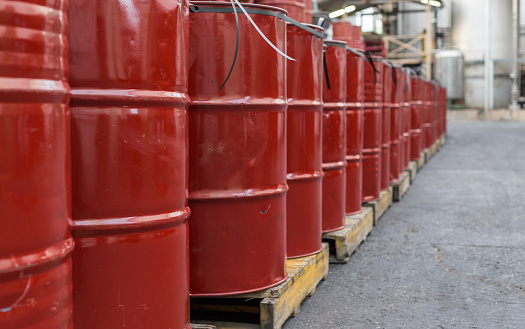 Large group of red oil barrels for industry.