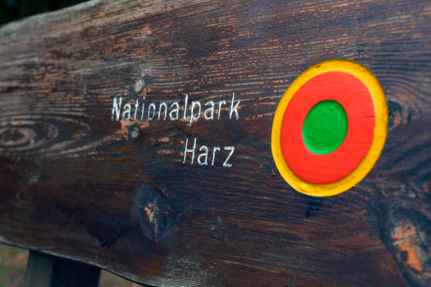 Harz National Park, Lower Saxony, Germany - 05-05-2019: Wooden sign with german words marking the Hard National Park.