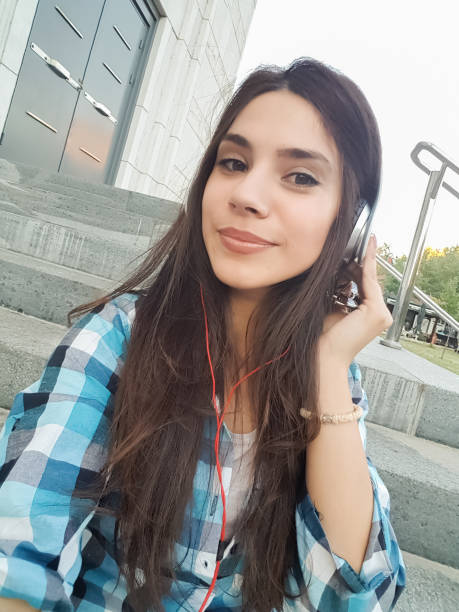 Urban girl making selfies downtown