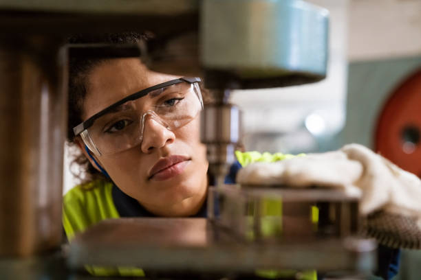 istock Mid adult engineer using yoke machine in factory 1149239658
