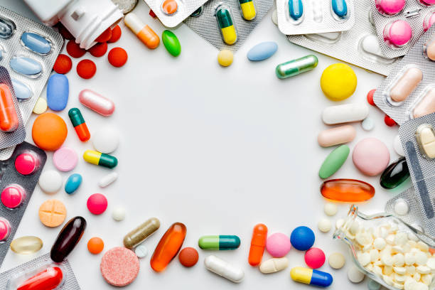 istock Large group of assorted capsules, pills and blisters making a frame on white background 1149240780