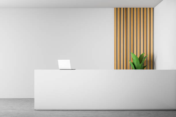 white reception table in white and wooden office - recepção imagens e fotografias de stock