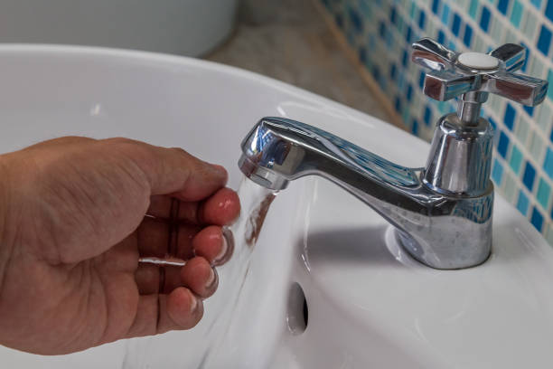 istock People washing hands under flowing tap water 1149241856
