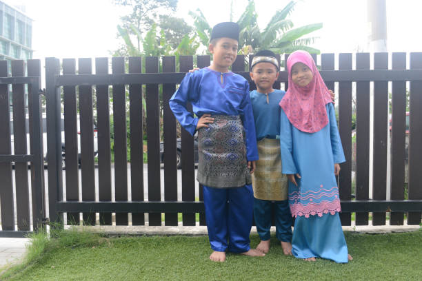 istock Malaysian children in traditional costume at home during Eid celebration 1149242591
